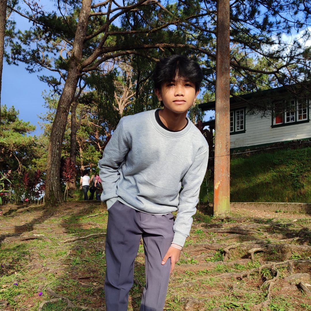 Camp John Hay Teenager wearing grey sweater posing for a picture